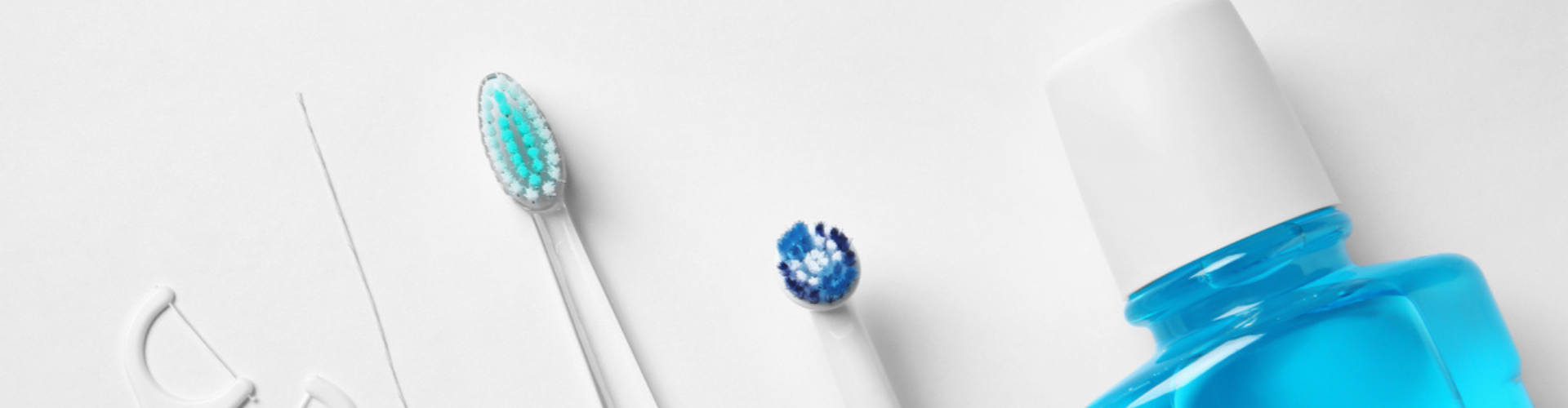 An image showing two toothbrushes and a bottle of mouthwash.